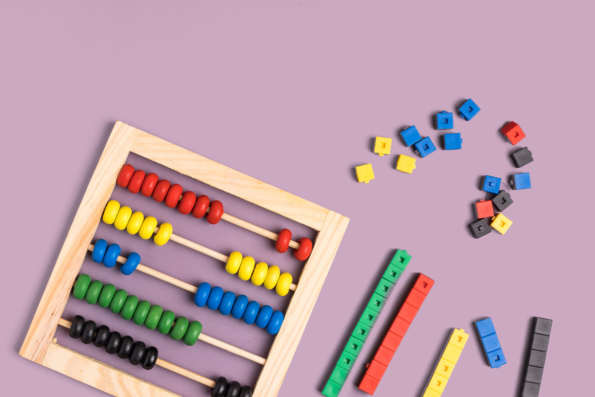 Abacus and Colorful Blocks on Purple Background